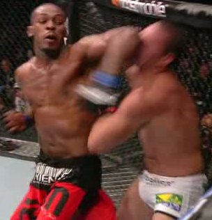 Jon Jones lands a spinning elbow on Mauricio "Shogun" Rua at UFC 128